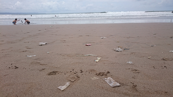 A beach covered with plastic rubbish.